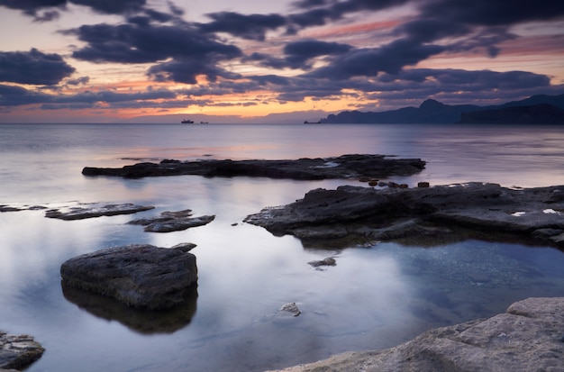 Colorful summer seascape. rocky coast at sunset