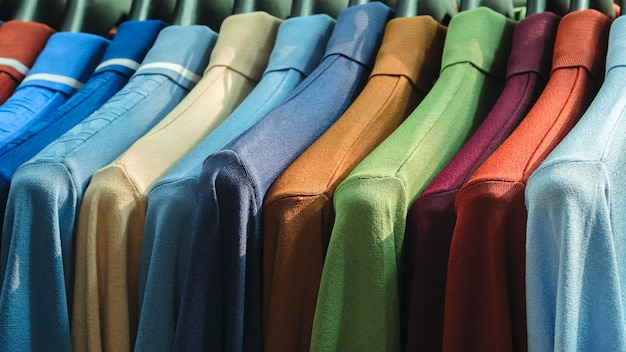Photo colorful summer tshirts in the market multicolored polo shirts in the market