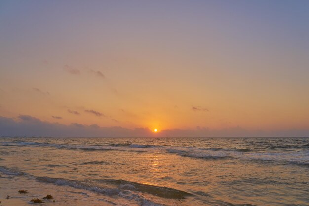 A colorful sunrise on the Caribbean coast on the Mexico