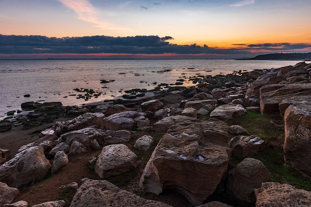 Colorful sunrise on the rocky coast