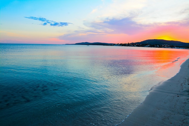 Colorful sunset in Maria Pia beach Sardinia