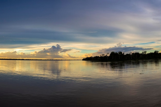 Colorful sunset on the river Amazon in the rainforest Brazil