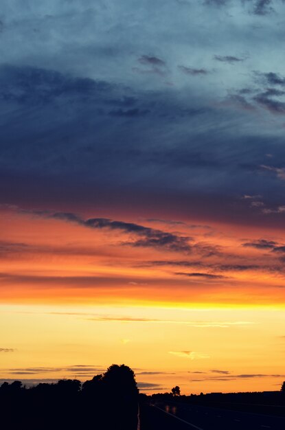 Colorful sunset over road. 