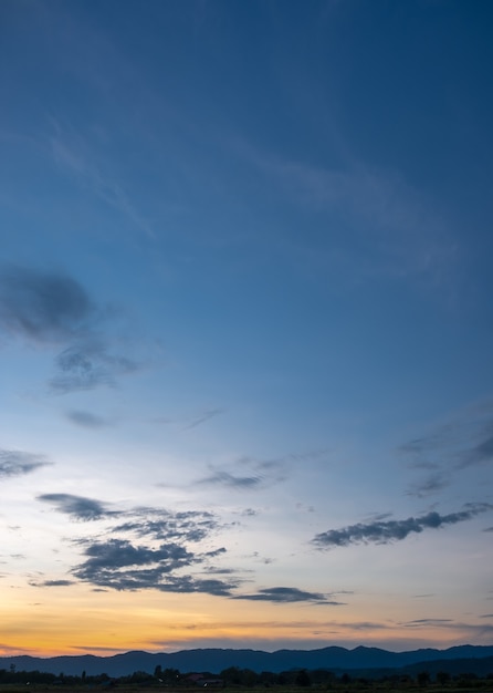 Colorful sunset and sunrise with clouds. Blue and orange color of nature. Many white clouds in the blue sky. The weather is clear today. sunset in the clouds. The sky is twilight.