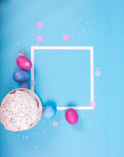 Colorful surface with easter eggs on blue surface