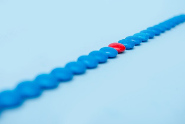 Colorful sweeties candy over blue table background.