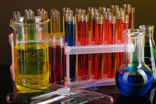 Colorful test tubes on dark background