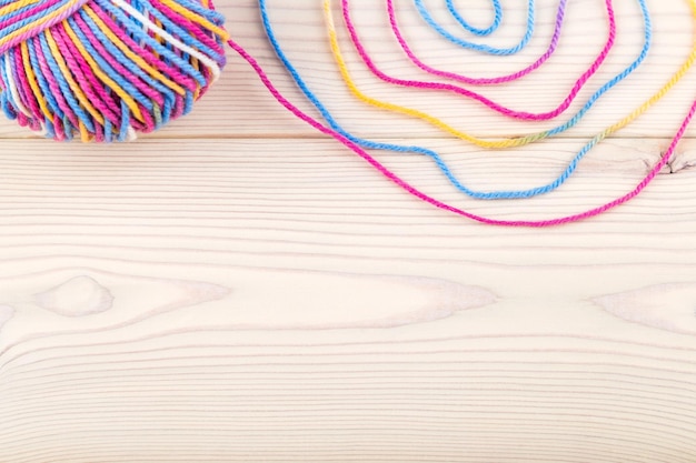 Colorful thread and bundle on table