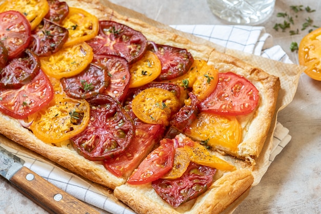 Colorful tomato puff pastry tart with thyme