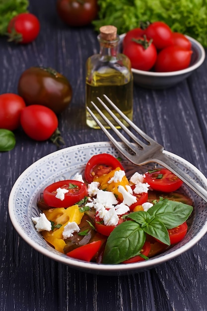 Colorful tomatoes salad with feta cheese