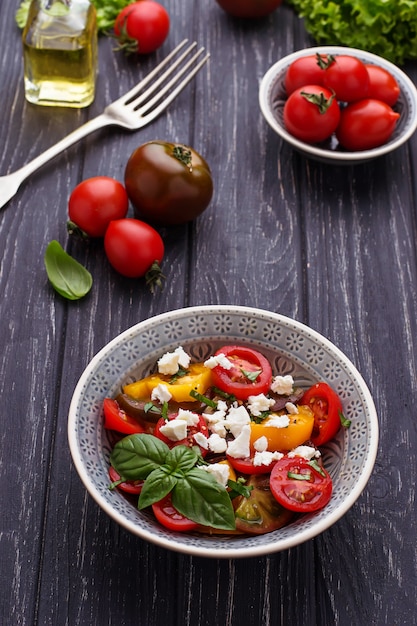 Colorful tomatoes salad with feta cheese