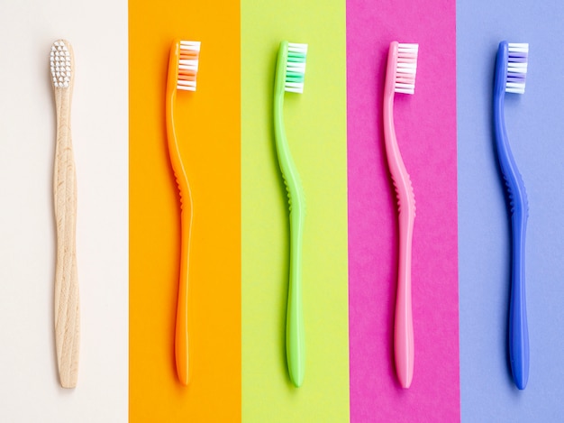 Colorful toothbrushes on colorful background