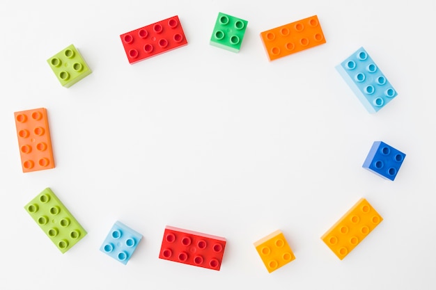 Colorful toy bricks on white background