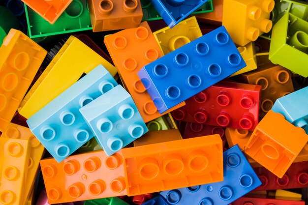 Colorful toy bricks on white background