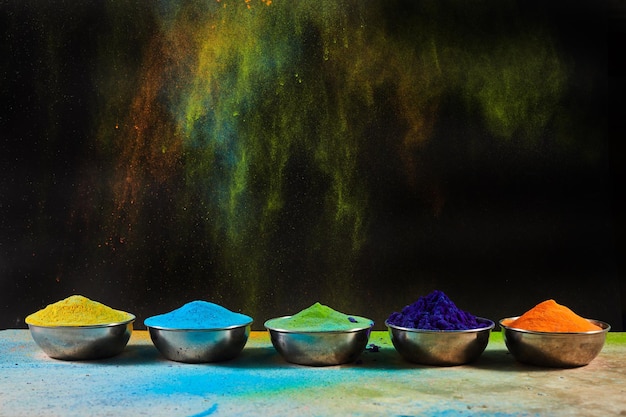 Colorful traditional Holi powder in bowls Happy Holi Concept Indian color festival