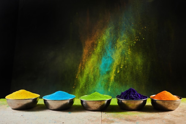 Colorful traditional Holi powder in bowls Happy Holi Concept Indian color festival