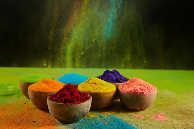 Colorful traditional Holi powder in bowls Happy Holi Concept Indian color festival