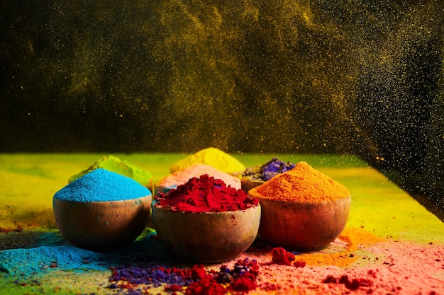 Colorful traditional Holi powder in bowls Happy Holi Concept Indian color festival