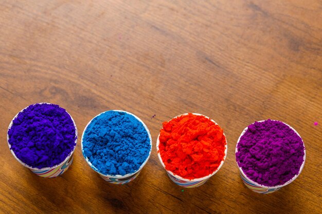 Photo colorful traditional holi powder in bowls happy holi concept indian color festival