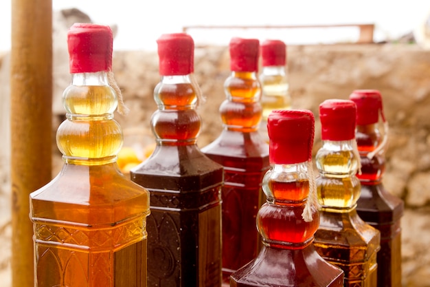 colorful traditional liquor bottles in rows