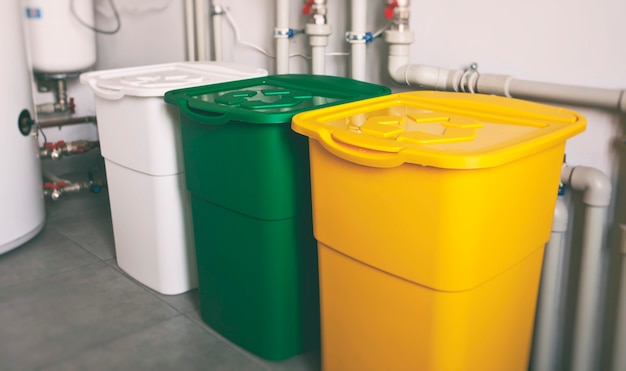 Colorful trash cans for sorting garbage plastic, glass and paper