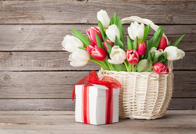 Colorful tulips bouquet and gift box