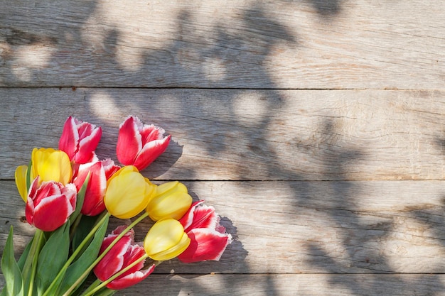 Colorful tulips on garden table