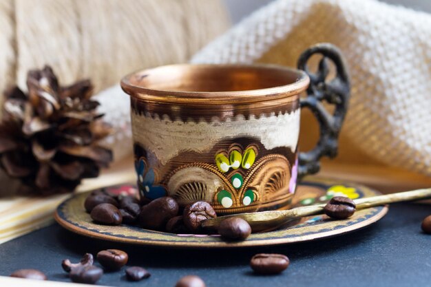 Colorful Turkish cup with coffee beans