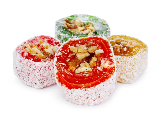 Colorful turkish delight with nuts in powdered sugar isolated on white