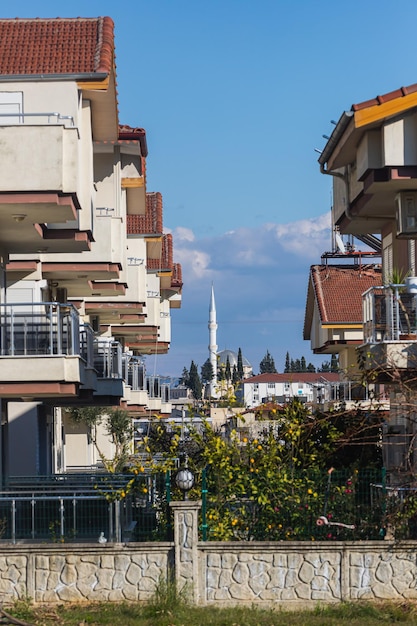 Colorful Turkish streets with low houses barrels of hot water on the roof and solar panels city mosque and hotels