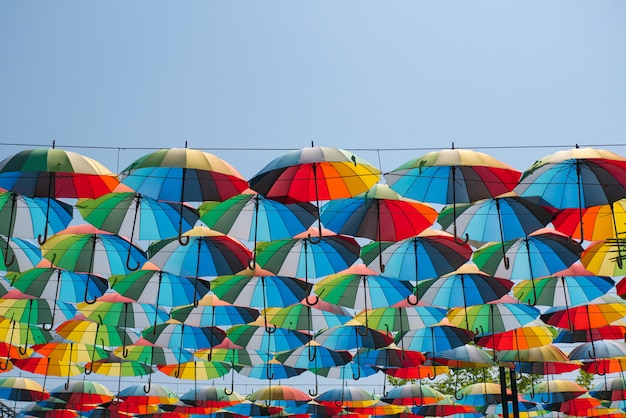 Colorful umbrellas float in the air