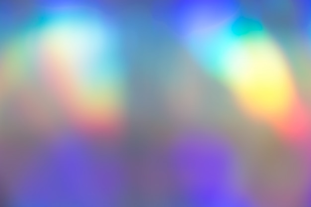 Colorful vibrant holographic pastel foil background texture. Toxic rave, party backdrop.