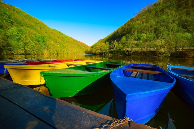 Colorful vivid fishing boats on lake hamori in lillafured,hungary, outdoor travel background