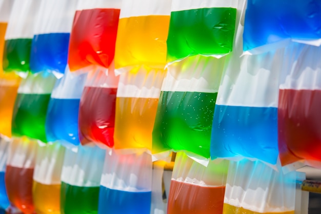 Colorful water in a hanging plastic bag.