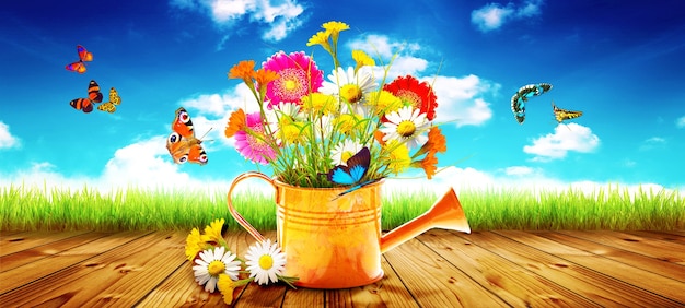 Colorful wild flower bouquet in a watering can with butterflies.