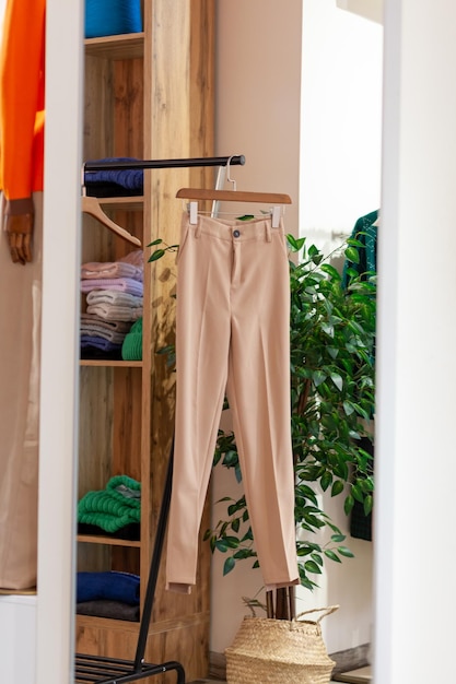 Colorful women39s dresses on hangers in a retail shop