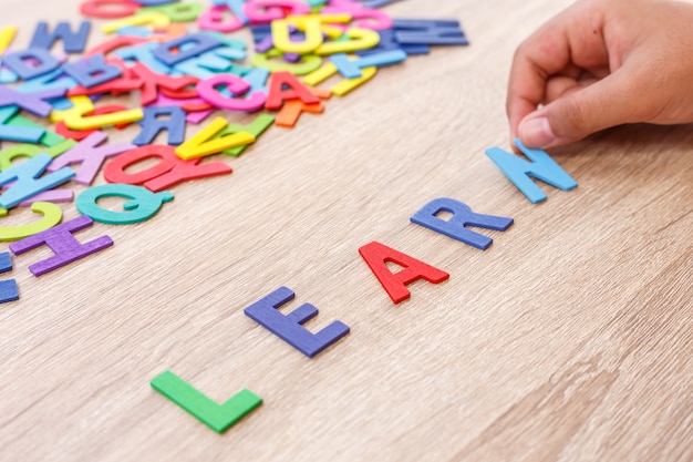 Photo colorful wooden alphabet and word