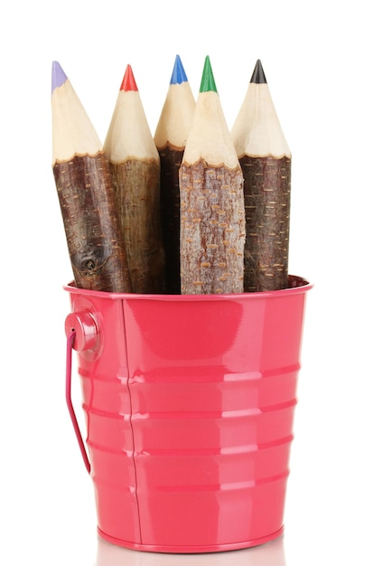 Colorful wooden pencils in pink purple green pail isolated on white