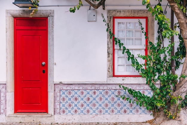 Colorful wooden traditional red doors in lisbon portugal