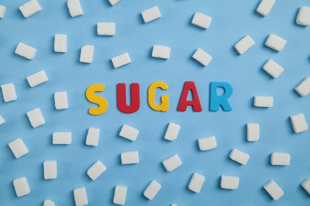 Photo colorful word sugar with sugar cubes.
