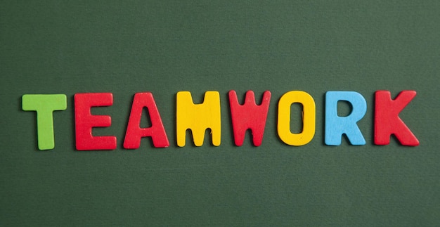 Colorful word Teamwork on green background