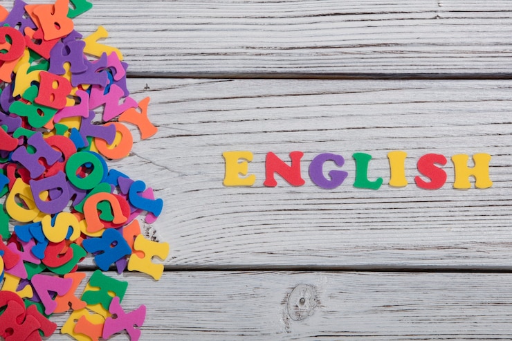 Photo the colorful words english made with colorful letters over white wooden board