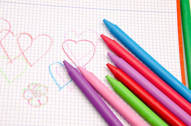 Coloring crayons with notebook