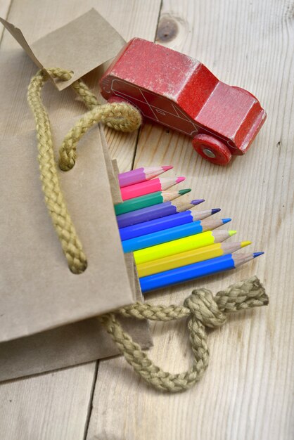 Colors pencils and toy on a table