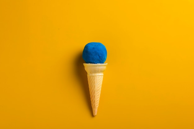 Colors in shapes of ice cream scoops in cones for Indian holi festival