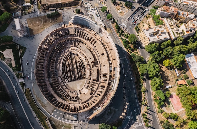 The Colosseum and the Imperial Forums in Rome beautiful aerial shot around the Colosseum Top view