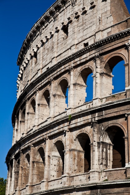 Colosseum in Rome with blue sky, landmark of the city