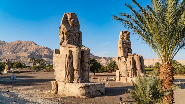 The colossi of memnon, two stone massive statues of the pharaoh amenhotep iii, who reigned in egypt during the dynasty xviii