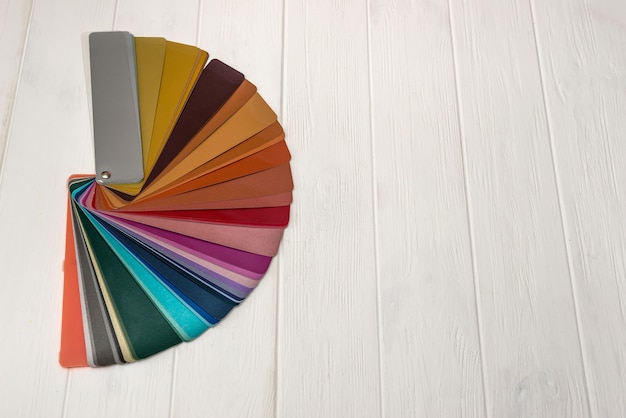 Colour guide in stripes on light wooden wall