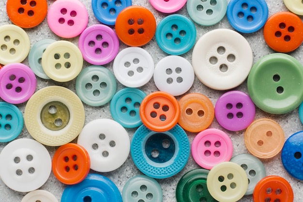 Photo coloured sewing buttons composition background